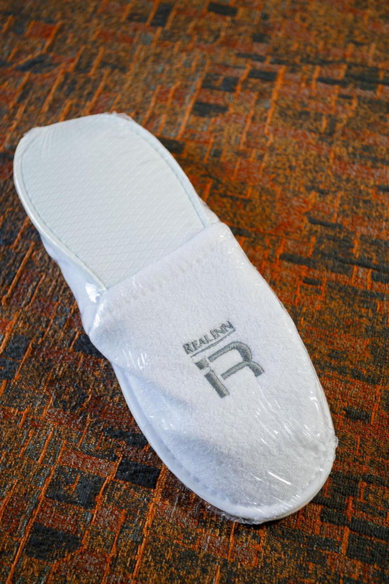 Real Inn Tijuana By Camino Real Hoteles Ngoại thất bức ảnh A pair of hotel slippers